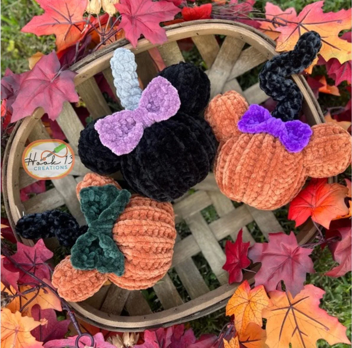Jennifer's crocheted mouse-eared pumpkins in a basket, with a Hook 13 Creations tag